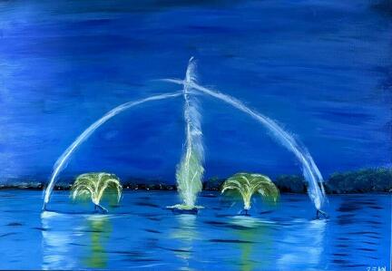 Fontänen im Tollensesee bei Neubrandenburg zur blauen Stunde